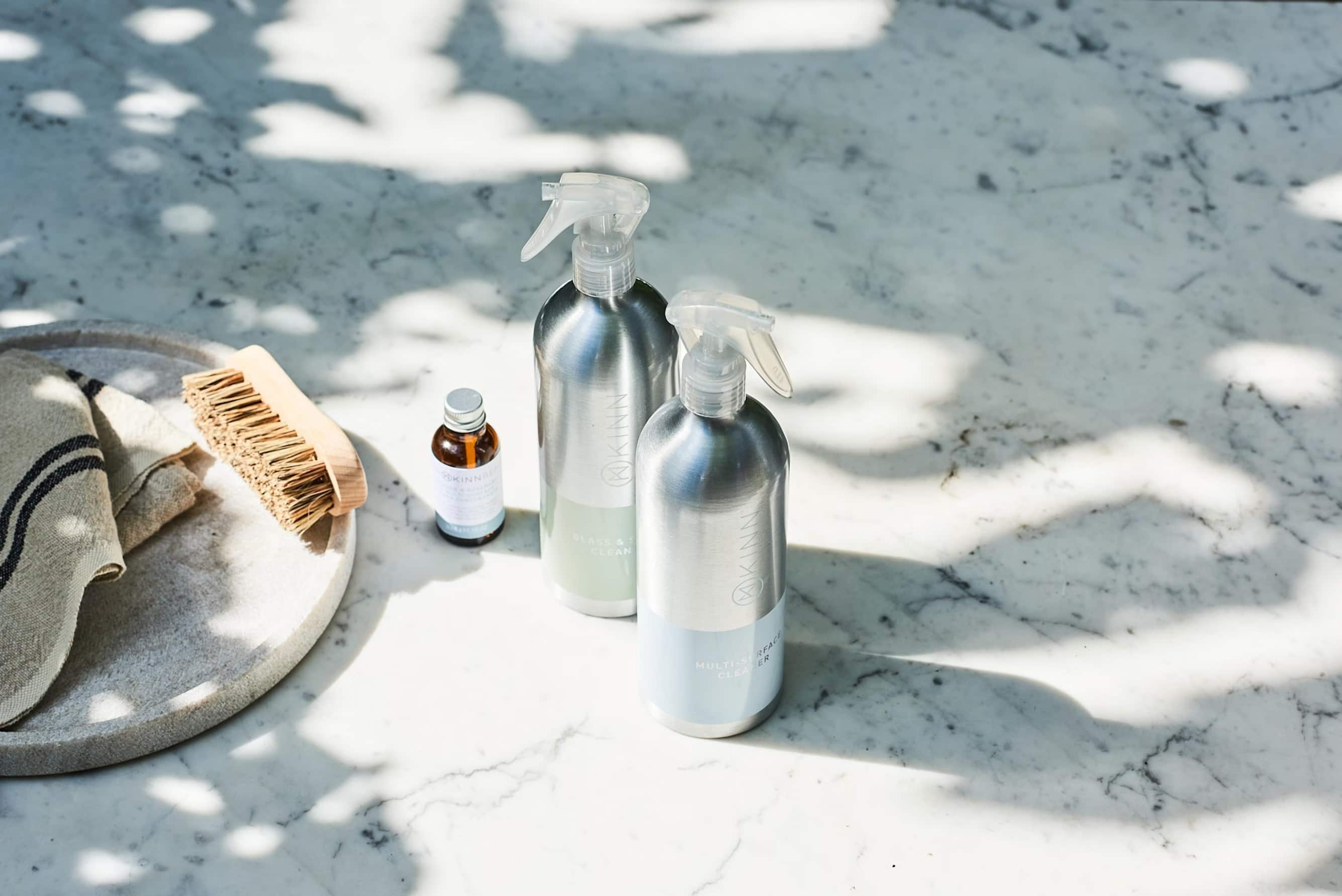 Two EcoPure spray bottles on a kitchen counter